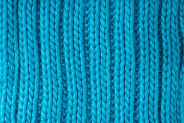 Cyan coloured knitted scarf