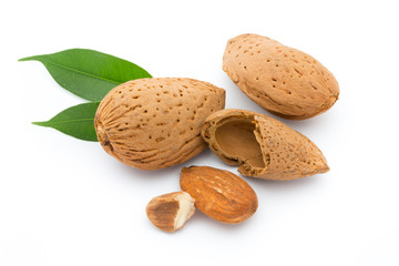 Almonds with leaves isolated on white background