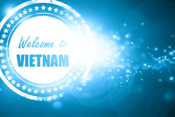 Blue stamp on a glittering background: Welcome to vietnam