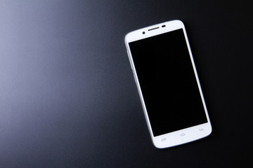 White smartphone concept on dark background