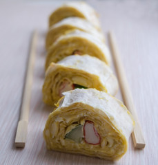 Cheese rolls with crab meat and cucumber