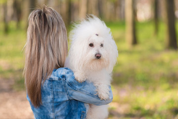 Beauty woman and her dog in the park