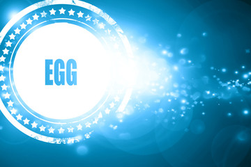 Blue stamp on a glittering background: Delicious egg sign