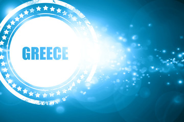 Blue stamp on a glittering background: Greetings from greece