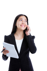 Successful businesswoman talking on the phone and holding note paper