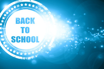 Blue stamp on a glittering background: back to school sign