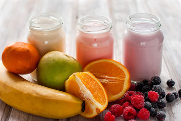 Fototapeta na wymiar Healthy yogurts with mix of berries