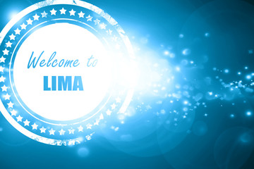 Blue stamp on a glittering background: Welcome to lima