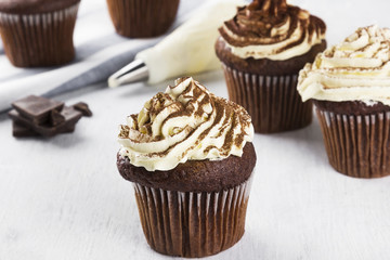 Chocolate cupcake decorated with cream