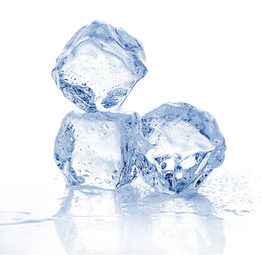 Three melting ice cubes on white background.