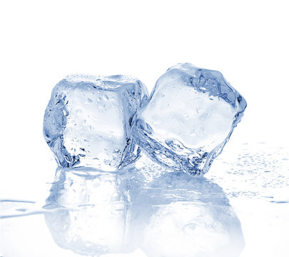 Two melting ice cubes on white background.