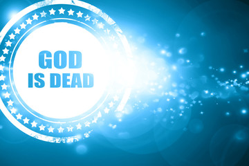 Blue stamp on a glittering background: god is dead