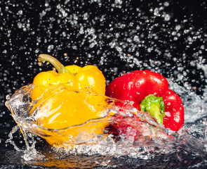 Fototapeta na wymiar Bell pepper in a splash of water