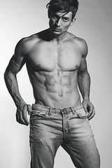 Bodybuilding, body sculpture concept. Male model with perfect bo
