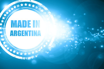 Blue stamp on a glittering background: Made in argentina