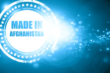 Blue stamp on a glittering background: Made in afghanistan