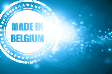 Blue stamp on a glittering background: Made in belgium