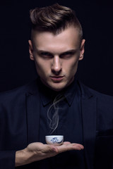 English tea beauty concept. Portrait of an young and handsome ma