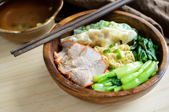 Egg chinese noodles with roast pork and dumpling