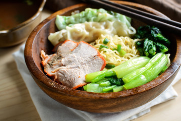 Egg chinese noodles with roast pork and dumpling