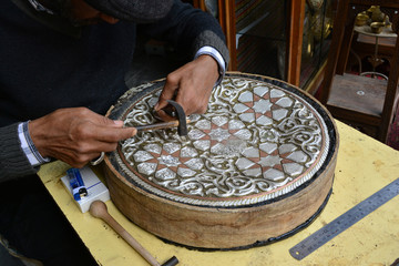 A man carving on metal in Damascus