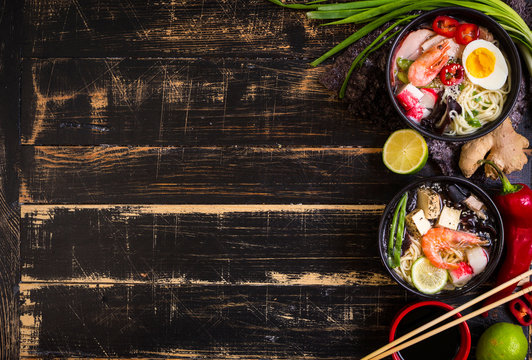 Table served with asian noodle soup background