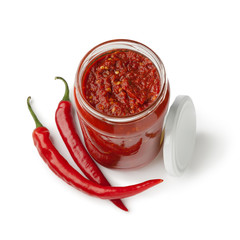 Jar with traditional Sambal and fresh red chili peppers