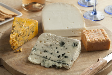 Variety of cheese on a wooden board