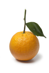 Single whole fresh orange with a leaf
