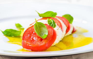 Caprese salad with mozzarella and tomatoes.