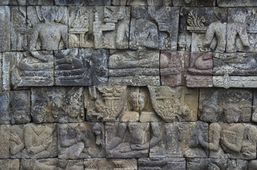 Stone bas-relief on the wall of Borobudur, Java, Indonesia