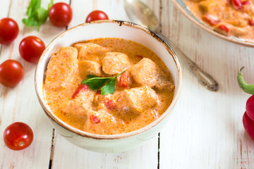 Delicious chicken stew with paprika in a bowl