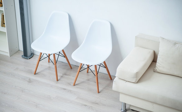 Chairs standing near the wall