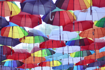 Fototapeta na wymiar umbrellas hung along the alley