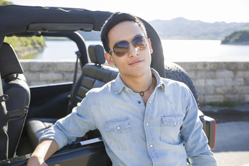 Young man and jeep