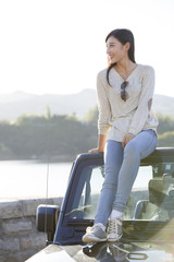 Young woman and jeep