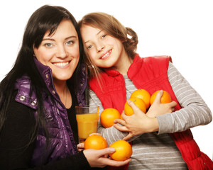 Fototapeta na wymiar child with mother holding oranges and juice