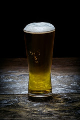 Beer mug on old wood background.