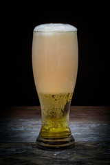 Beer mug on old wood background.