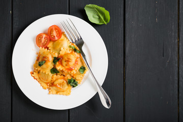 Ravioli with tomato sauce and basil