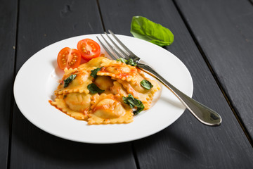 Ravioli with tomato sauce and basil