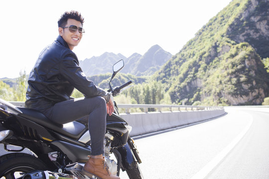 Young man riding motorcycle