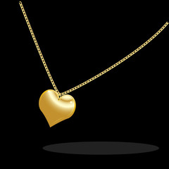 Necklace with golden heart on a black background