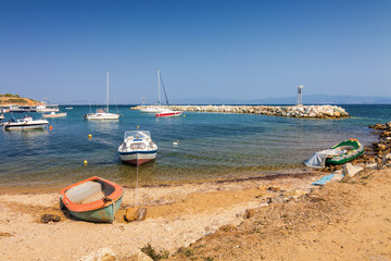 Fototapeta na wymiar Boats in Bay of Nea Fokia village, Halkidiki, Greece.