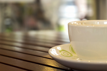 close-up, Cup of Coffee on table in coffee shop [blur and select focus background]