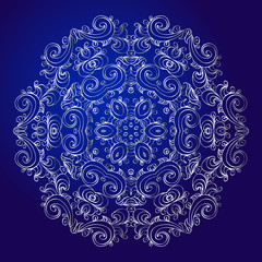 Mandala, amulet. Esoteric silver symbol on a blue background.