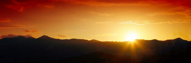 Fototapeta premium Sunrise over black forest mist.