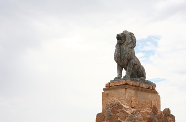  Bronze Lion and Mission San Xavier del Bac, which  is a historic Spanish Catholic mission located about 10 miles south of downtown Tucson, Arizona,