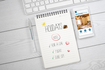 white desktop with booking room web and holidays planning