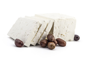 Sliced fresh white cheese from cow's milk with kalamata black olives on white background